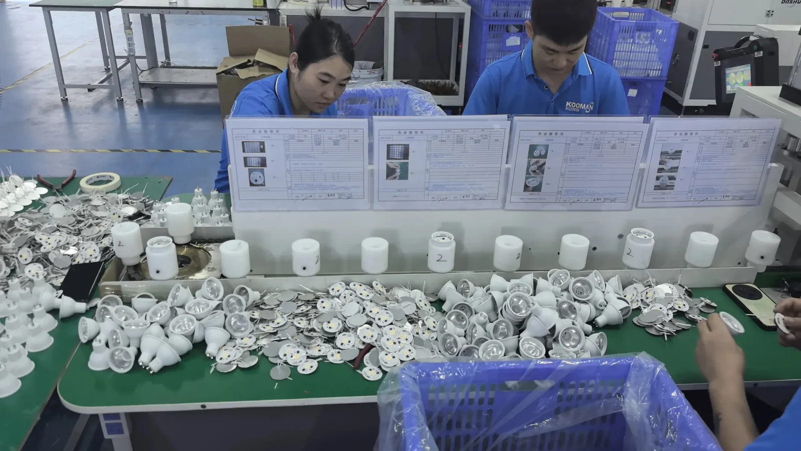 Workers assembling lighting products